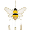 A bee-shaped windchime with yellow and black color pattern, hanging outdoors.