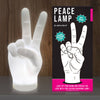 Peace lamp and its packaging on a wooden surface