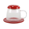Clear glass mug with red lid and base on a white background