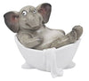 Gray elephant figurine taking a bath in a white bathtub on a white background