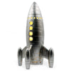 A large silver rocket-shaped night light table lamp with circular windows illuminated from the inside.