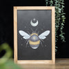 Lunar Bee Framed Wall Print