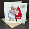 Christmas card with illustration of Santa Claus and a woman, featuring text 'hope you get everything you wish for this Christmas!'.