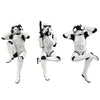 Three stormtrooper figures in various poses on a white background