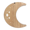 Wooden moon-shaped decoration with cut-out stars on a white background