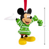 Mickey Mouse ornament wearing a green sweater with white snowflakes on a white background