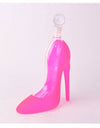Pink high-heeled shoe-shaped bottle on a white background